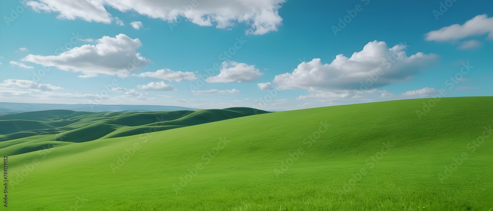 Amazing panoramic of beautiful green grass field on hills and blue sky with clouds. Spring summer landscape background concept. Amazing panoramic of beautiful green grass field on hills and blue sky with clouds. Spring summer landscape background concept.