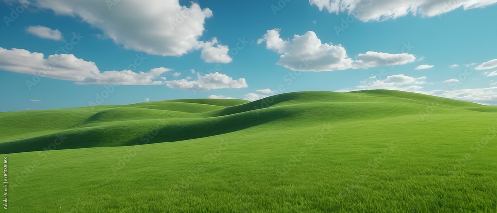 Amazing panoramic of beautiful green grass field on hills and blue sky with clouds. Spring summer landscape background concept.