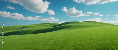 Amazing panoramic of beautiful green grass field on hills and blue sky with clouds. Spring summer landscape background concept.