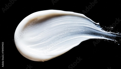 White face cream smear on black background isolated. Cosmetic products for makeup and skin care.