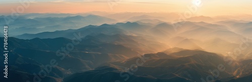 panoramic aerial view of the beautiful mountains at sunrise, during the golden hour, with perfect weather during the summer time photo