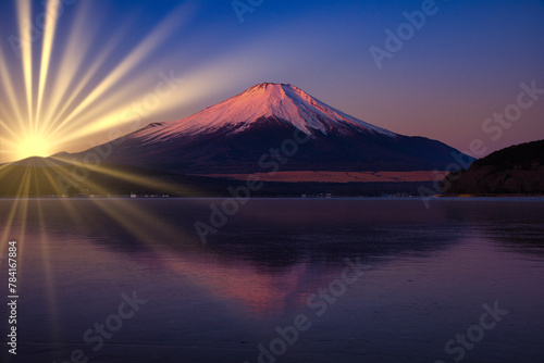 富士山に光放つ太陽光線合成 photo