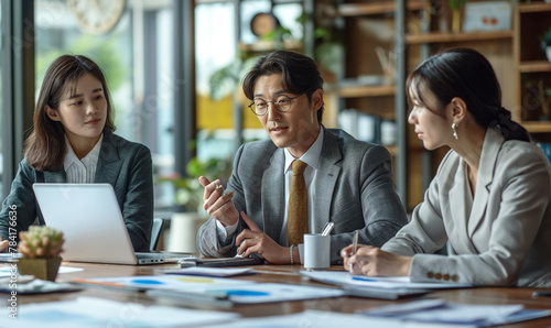 Office workers giving a presentation in a bright