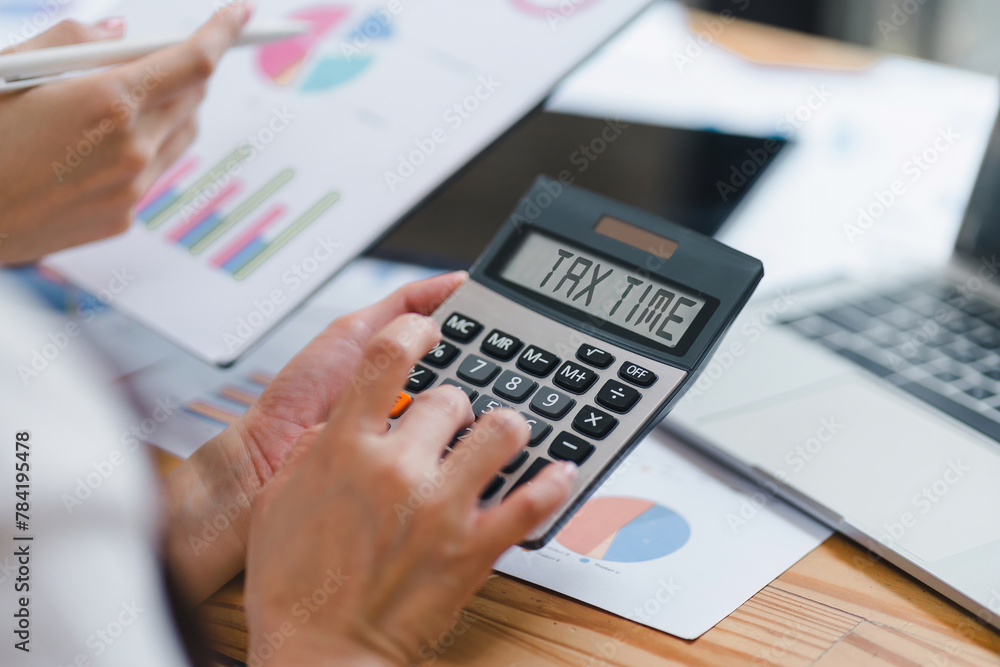 Close-up of hands using calculator with Close-up of hands using calculator with
