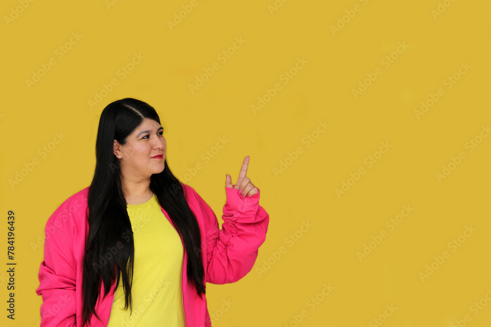 Excited and happy 30-year-old Latin woman shows and points with her hands to promotions and discounts Excited and happy 30-year-old Latin woman shows and points with her hands to promotions and discounts