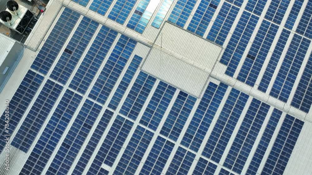 From the skies, witness a symphony of blue solar panels harmonizing ...