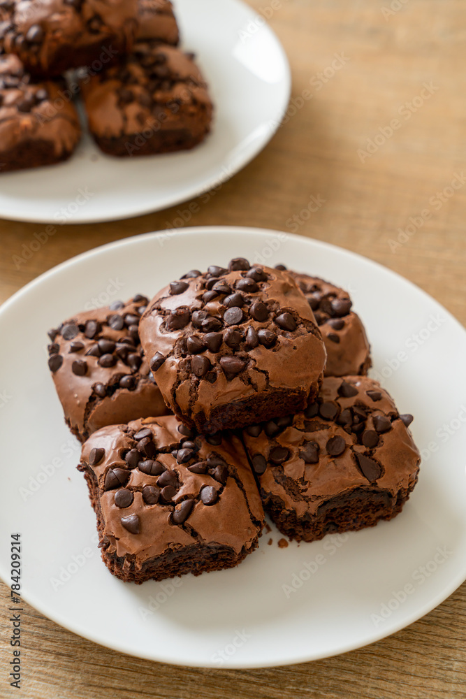 dark chocolate brownies topped by chocolate chips dark chocolate brownies topped by chocolate chips