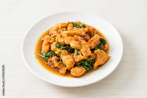 stir-fried fried fish with basil and chili in thai style