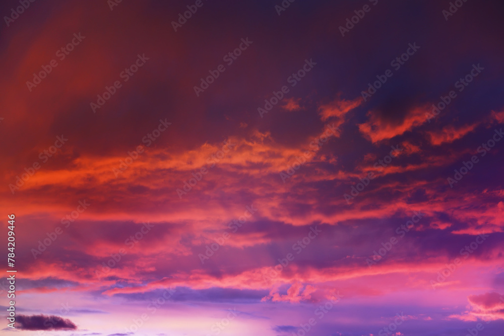 Fototapeta premium Beautiful sunset sky above clouds with dramatic light. Cabin view from airplane