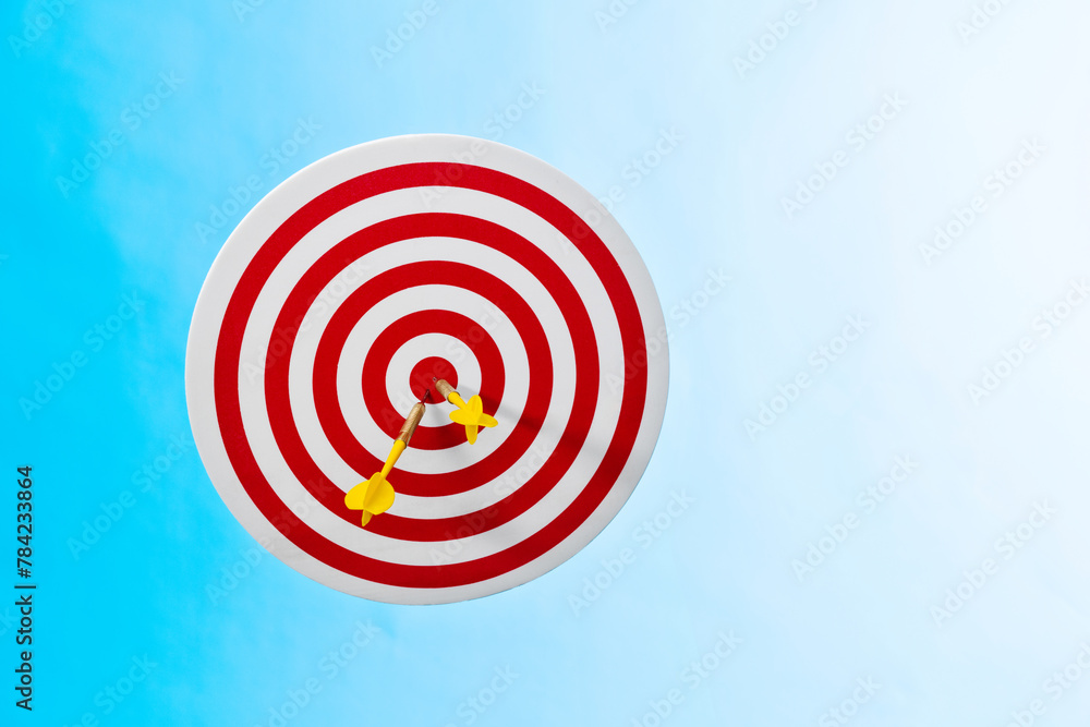 Three darts hitting on center target