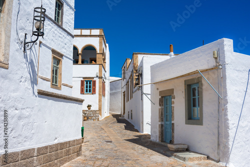 Streets of Chora and iconic Monastery of Saint John the Theologian in chora of Patmos island, Dodecanese, Greece © gatsi