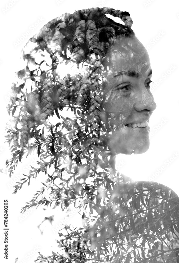 A double exposure female portrait merged with young tree branches photo A double exposure female portrait merged with young tree branches photo