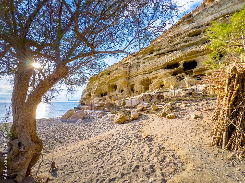 Matala beach with caves on the rocks that were used as a roman cemetery and at the decade of 70's were living hippies from all over the world, Crete, Greece