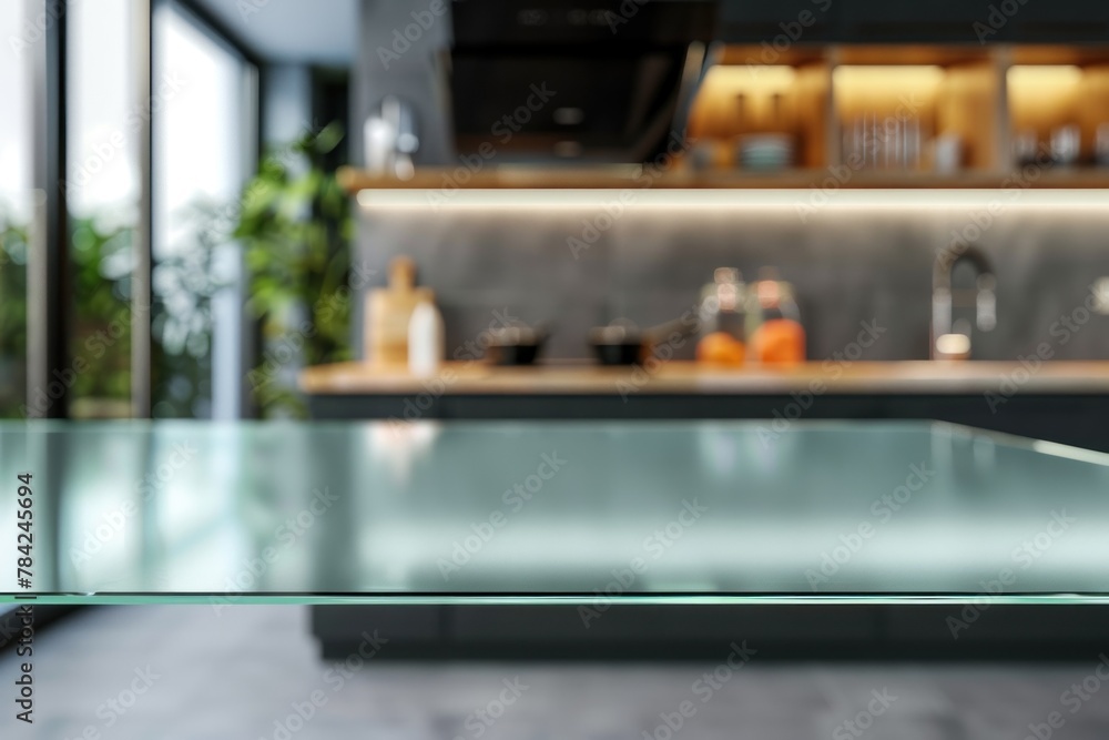 Modern kitchen interior with blurred focus on glass table foreground. Modern kitchen interior with blurred focus on glass table foreground.