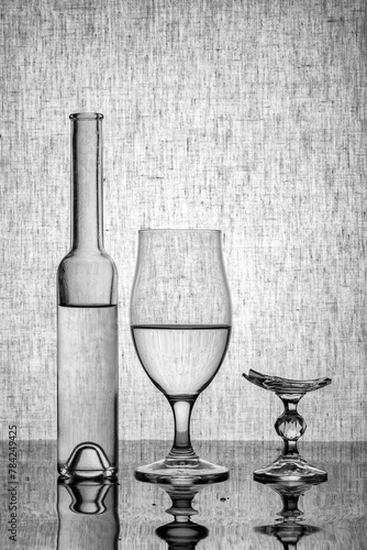Still life with glassware and a broken glass