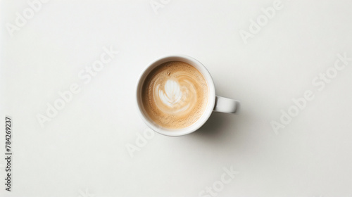 Photo of coffee cup from above with beautiful pattern. White background © CozyDigital