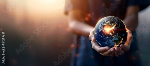 Photo of a person holding a globe with copy space on the right