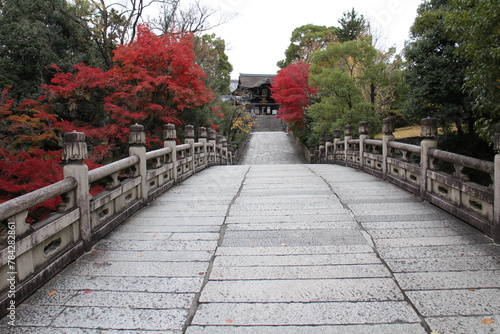 The stone bridge, Main Gate and autumn leaves in Otani-Hombyo, Kyoto, Japan