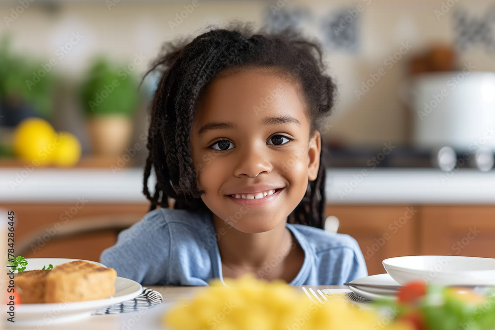 Smiling young girl at breakfast table with healthy food in a cozy home kitchen. Smiling young girl at breakfast table with healthy food in a cozy home kitchen.