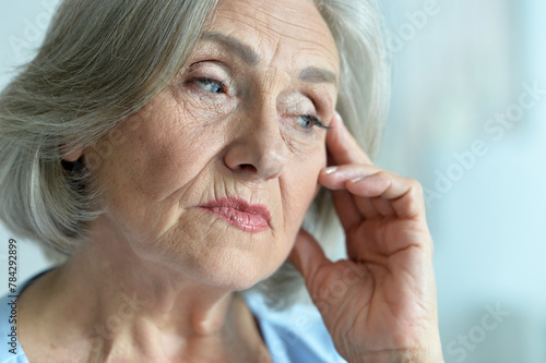 Close up portrait of a sick senior woman