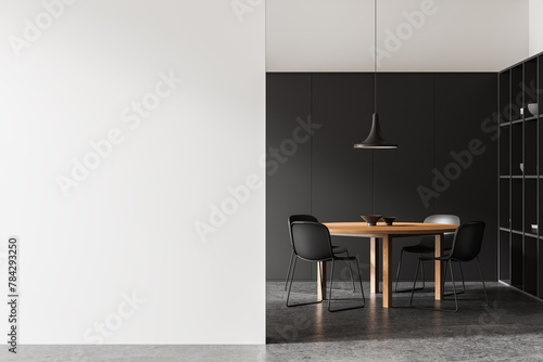 Modern dining room interior with a wooden table, black chairs, and a pendant lamp. Black and white background, minimalist concept. 3D Rendering © ImageFlow