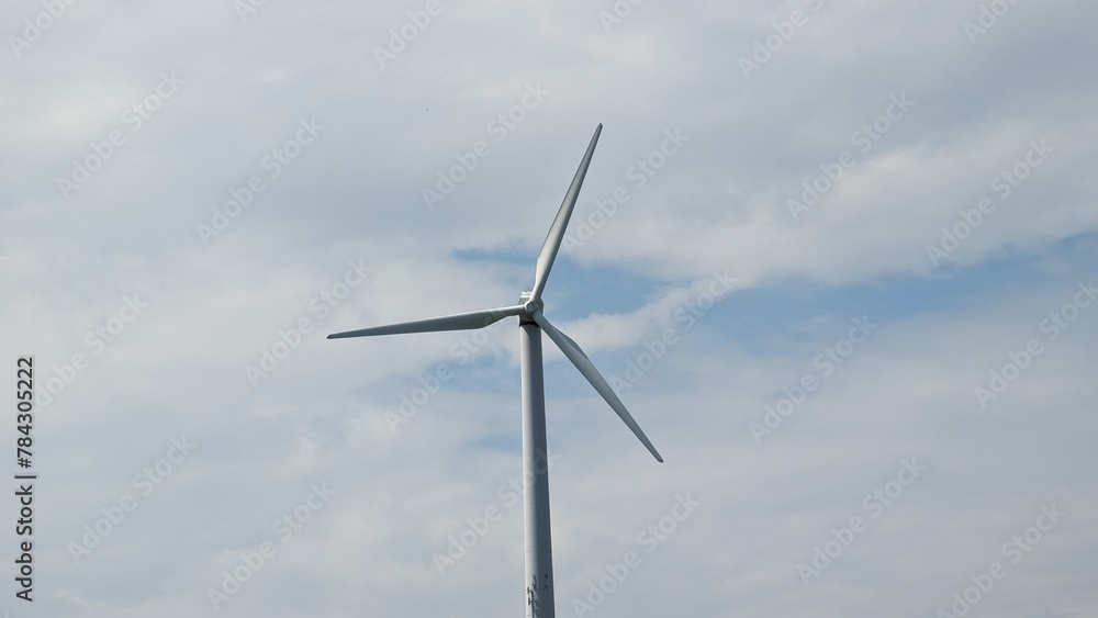 Wind turbines on the beautiful autumn meadow.