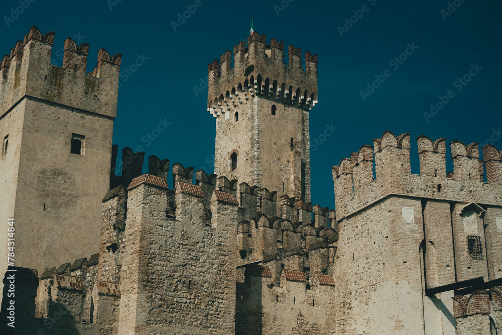 Scenic view of a medieval castle at Garda Lake in Sirmione, Italy