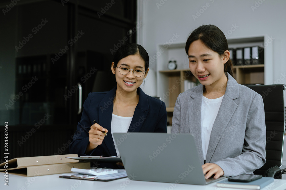 Businessmen team or financial data analysts working with tablets and laptop computers and data graphs together. Businessmen team or financial data analysts working with tablets and laptop computers and data graphs together.