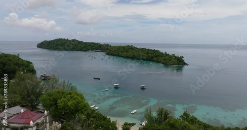 Top view of Rubiah island with jungle and blue sea. Aceh, Indonesia. photo