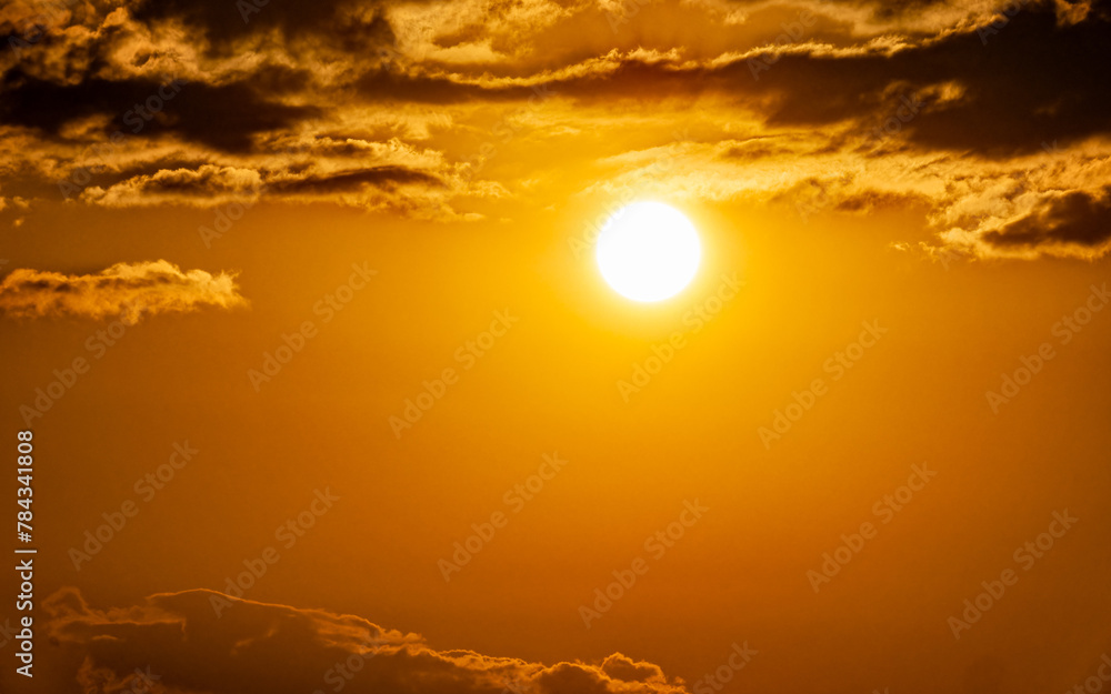 An impressive cloudy sundown orange sky. Space for your text and logo.