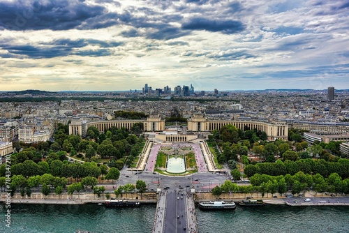 View over the Palais de Chaillot with the Paris cityscape in the background under a cloudy sky photo