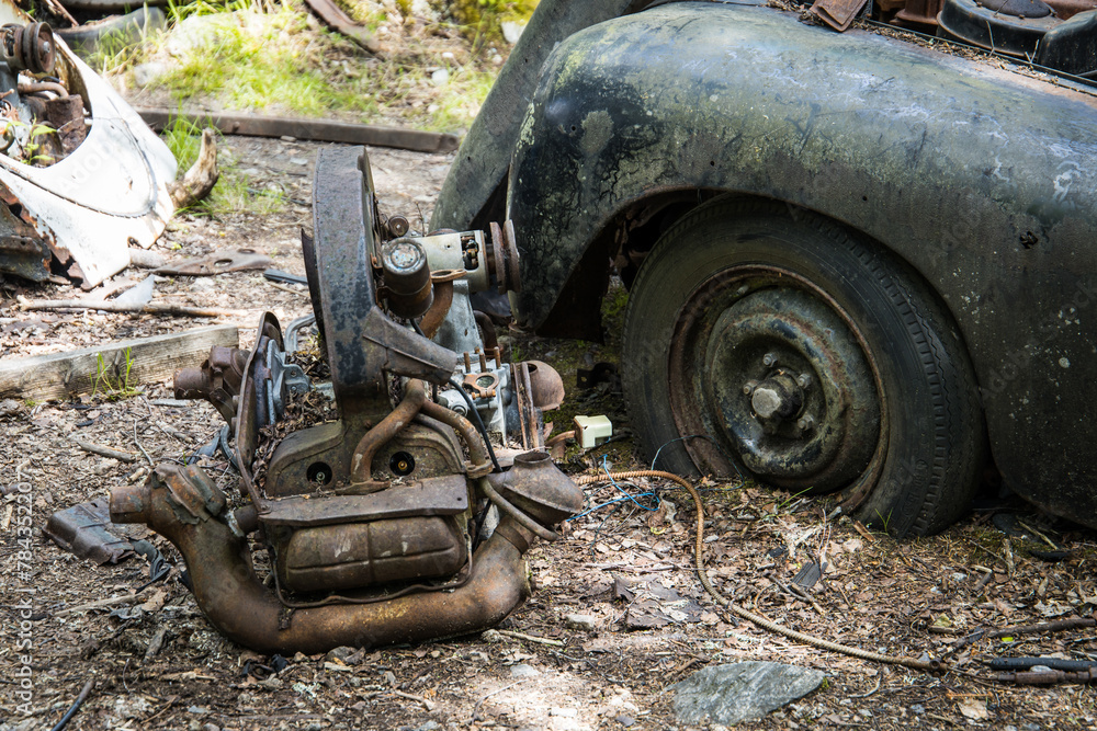 Scrapyard with car parts in the nature
