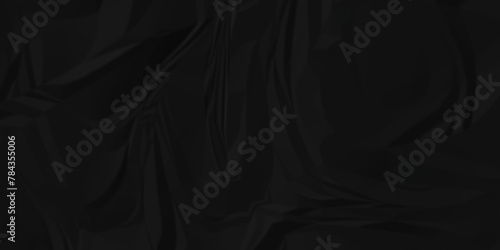 Dark black crumple paper wrinkled poster template ,blank glued creased paper texture background. black paper crumpled backdrop background. used for cardboard.	
