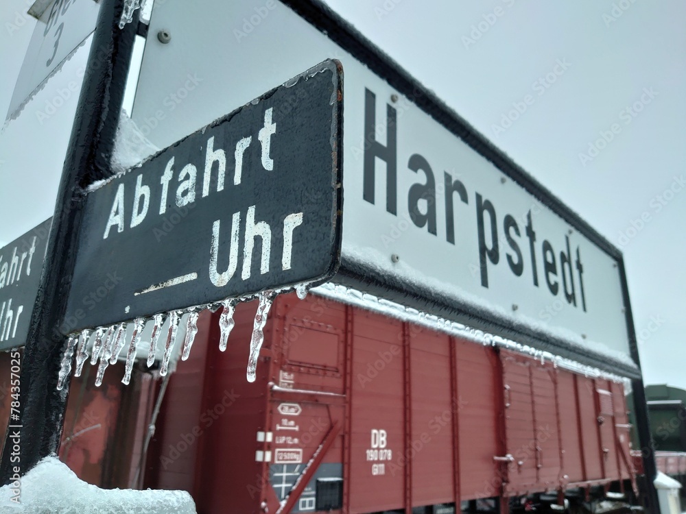 Closeup shot of small icicles hanging on a banner at a train station in Germany