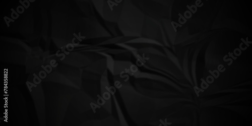 Dark black crumple paper wrinkled poster template ,blank glued creased paper texture background. black paper crumpled backdrop background. used for cardboard.