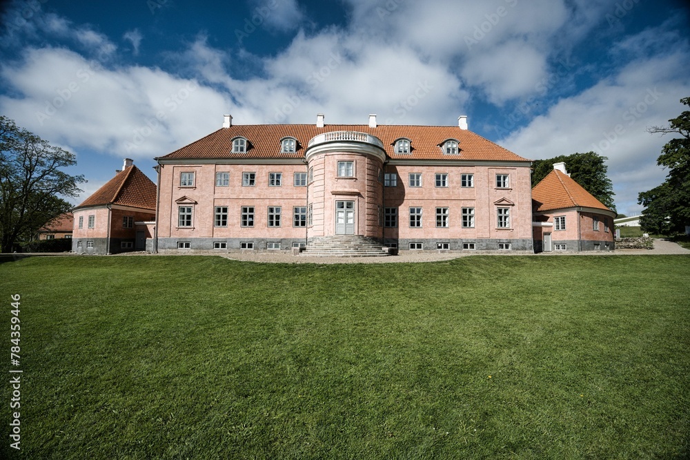Scene of the Moesgaard Museum with a beautiful yard in the daytime in Aarhus, Denmark Scene of the Moesgaard Museum with a beautiful yard in the daytime in Aarhus, Denmark