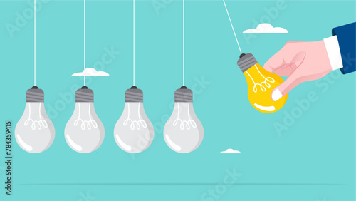 knowledge sharing or experience to inspire the team, provide education or expertise to the team to achieve mutual success, businessman hand pull bright light bulb as pendulum to transfer knowledge