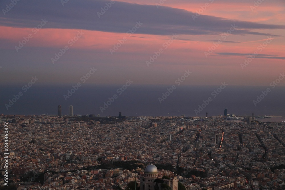 Aerial shot of the cityscape of Barcelona, Spain at sunset Aerial shot of the cityscape of Barcelona, Spain at sunset