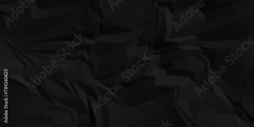 Dark black crumple paper wrinkled poster template ,blank glued creased paper texture background. black paper crumpled backdrop background. used for cardboard.