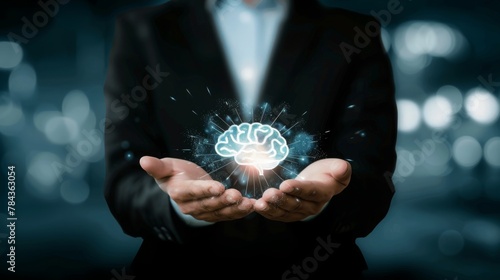 Business holding virtual brain icon for education and creative thinking idea to problem solving concept.