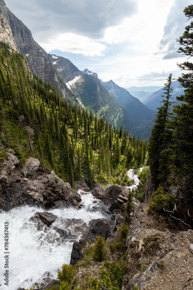 Breathtaking view of the Glacier national park under a cloudy sky Breathtaking view of the Glacier national park under a cloudy sky