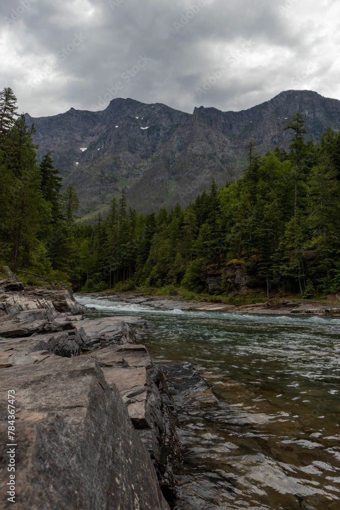 Breathtaking view of the Glacier national park under a bright cloudy sky Breathtaking view of the Glacier national park under a bright cloudy sky
