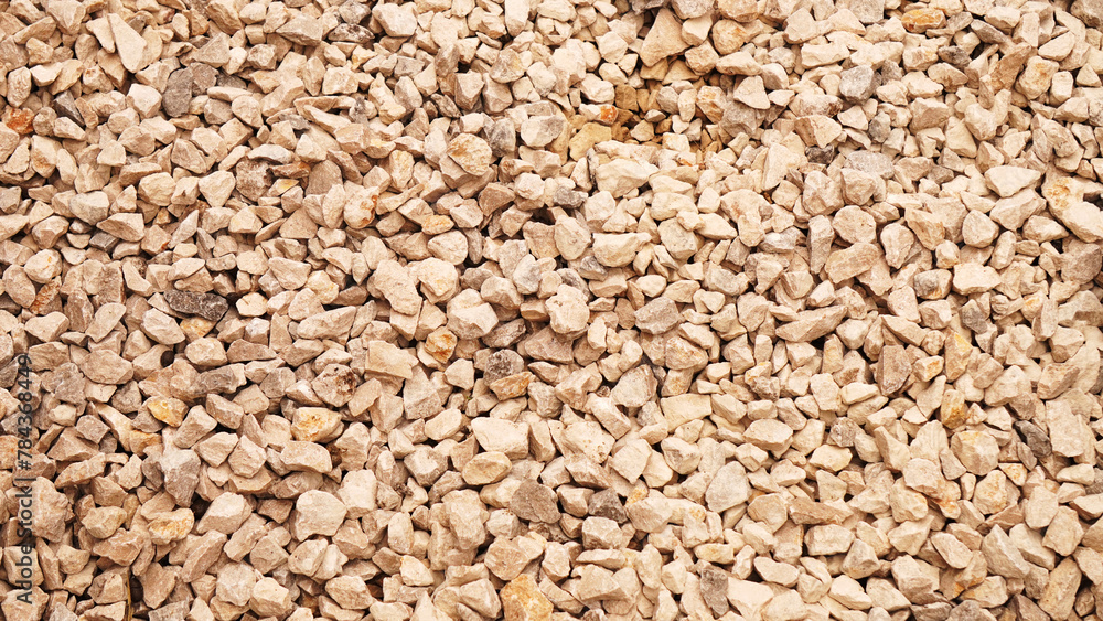 background, yellowish gravel with reflections of sunlight background, yellowish gravel with reflections of sunlight