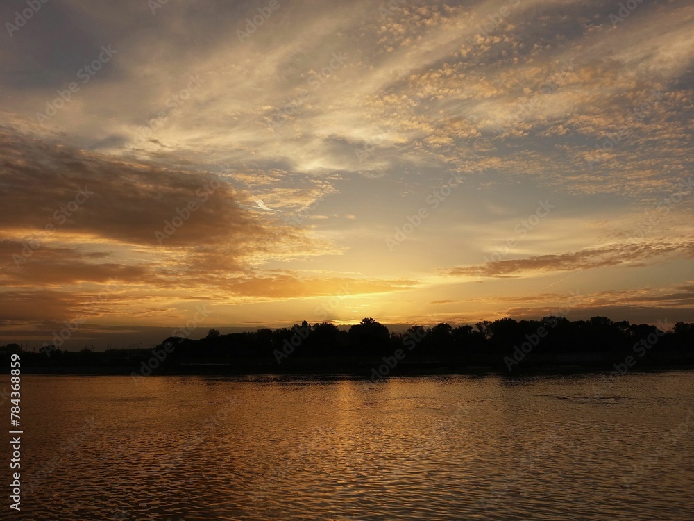 Landscape of the river in the morning light of a rising sun and Landscape of the river in the morning light of a rising sun and