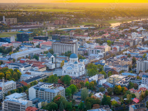Aerial landscape view of Kaunas new city center with sobor in middle during a sunset. photo