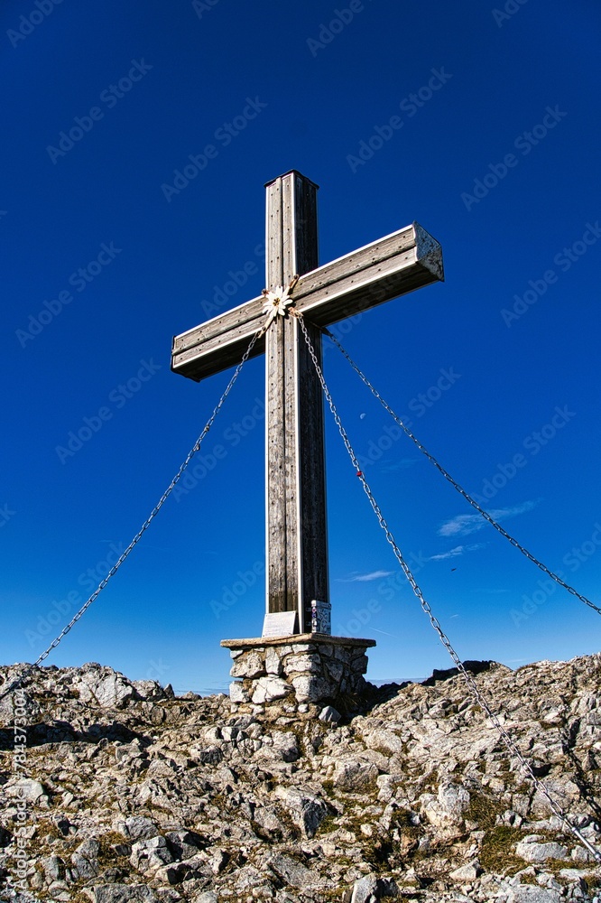 Vertical shot of the historic cross on the summit of Veitsch Mountain in Austria
