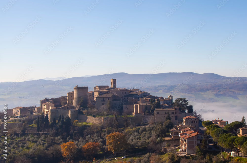 Scenic Gualdo Cattaneo, a hilltop village shrouded in fog, Umbria, Italy