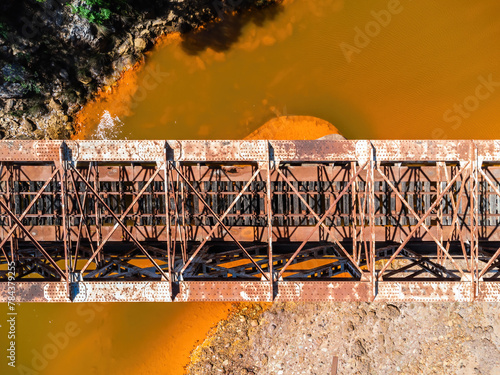The Salomon Bridge crossing the red river, Rio Tinto, is a railway bridge in the province of Huelva and was originally part of the Riotinto railway for the transportation of copper mineral to Huelva