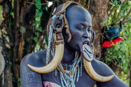Ethiopia, a woman from the Mursi tribe with beautiful head decoration. Omo Valley, Jinka, 21/02/2024 photo