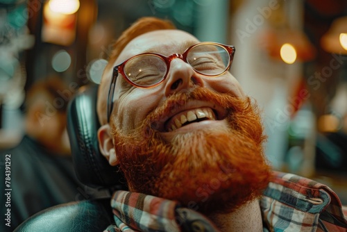 A man with a beard and glasses smiling. Perfect for business and lifestyle concepts